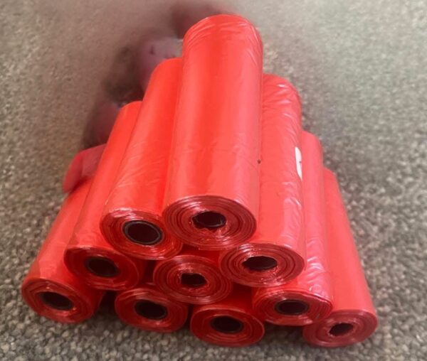 Pack of 10  rolls with  15 strong  poo bags plain red